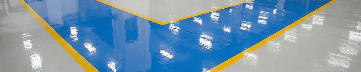 A factory floor professionally covered and marked with epoxy flooring in Bakersfield, CA