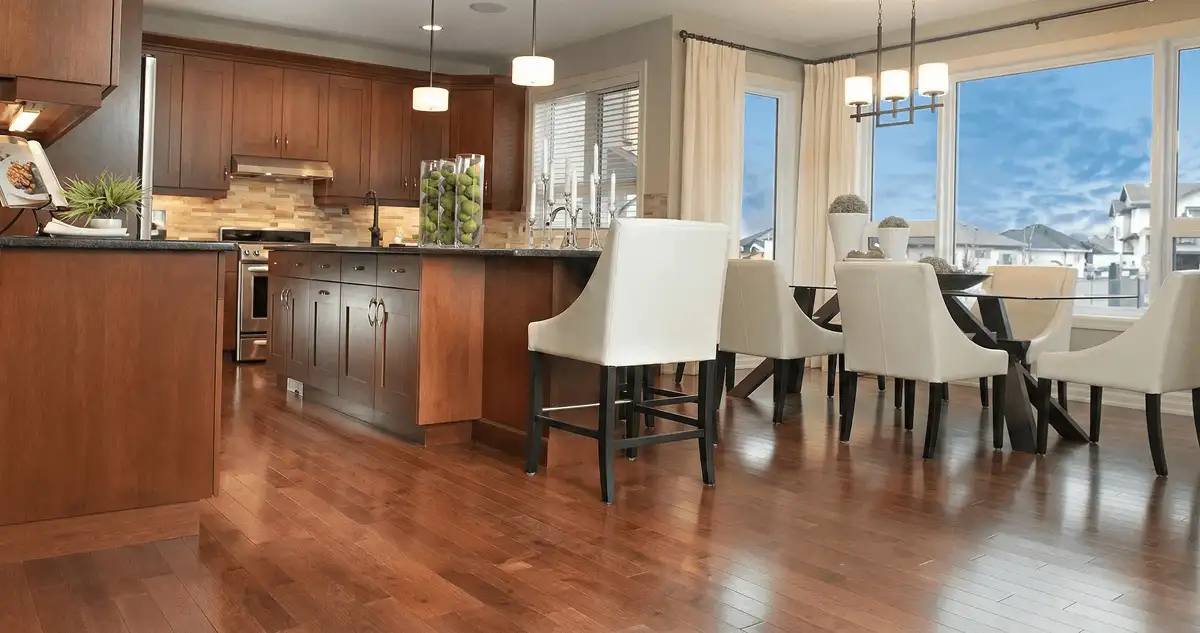 A modern kitchen with professionally installed wood flooring in Bakersfield, CA