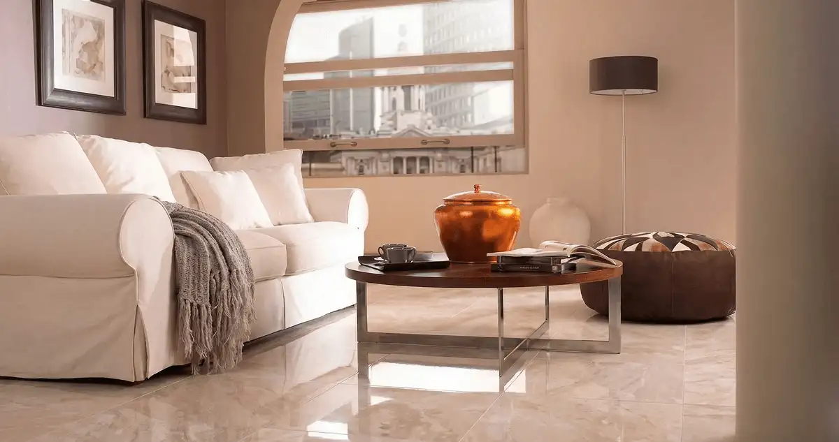 Modern living room with professionally installed marble flooring, a beige sofa, coffee table in Bakersfield, CA