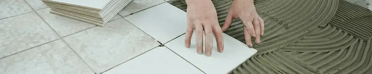 Professional installing white tile floors in Bakersfield, CA