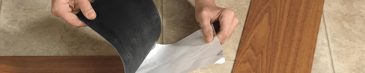 A professional installing vinyl flooring in Bakersfield, CA
