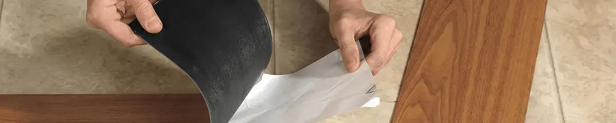 A professional installing vinyl flooring in Bakersfield, CA